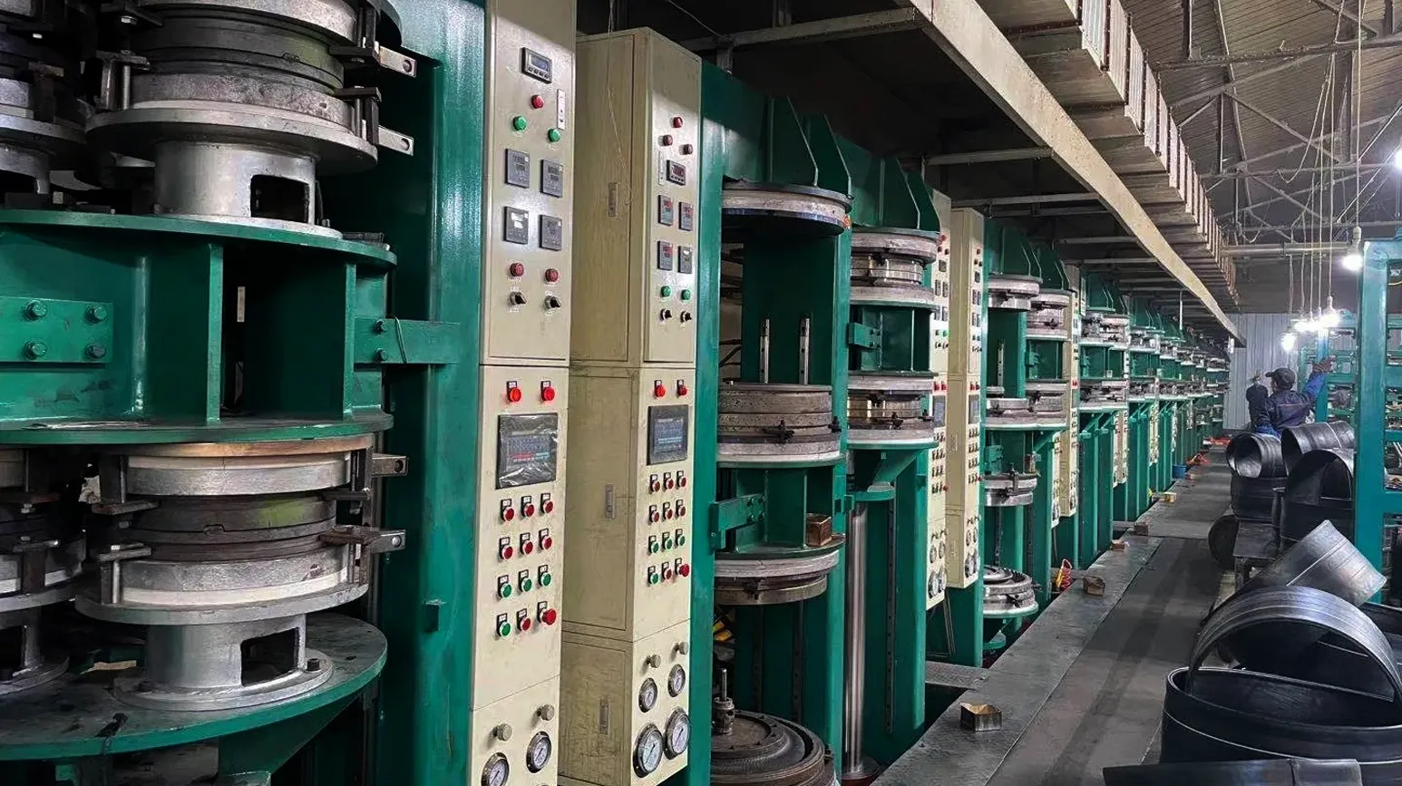 Industrial tyre moulding and curing machines used in bicycle tyre manufacturing, showcasing precision-controlled production equipment for durable and high-performance tyres.