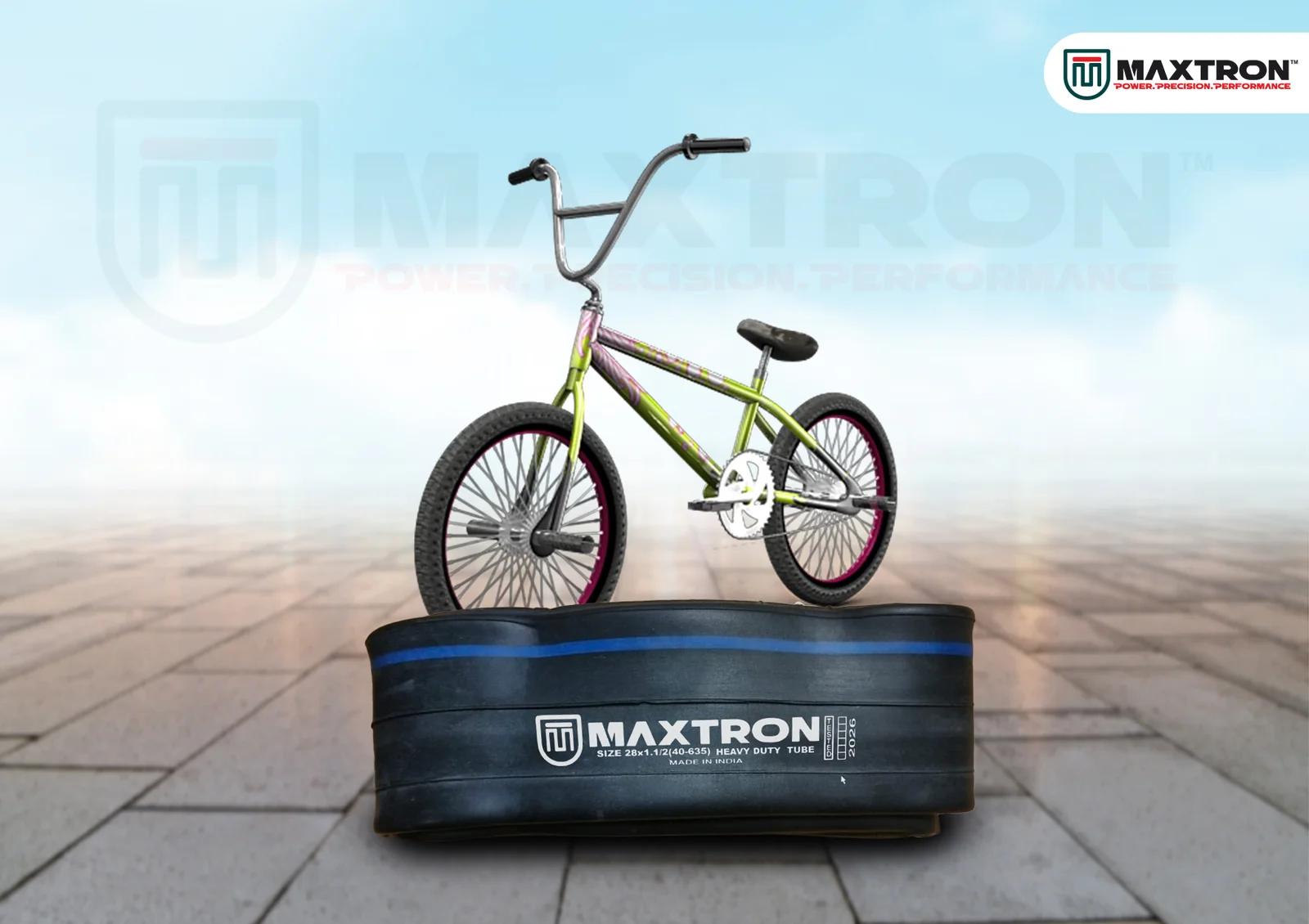 BMX bicycle displayed above a Maxtron heavy-duty butyl inner tube, highlighting durability and performance for BMX riding applications.