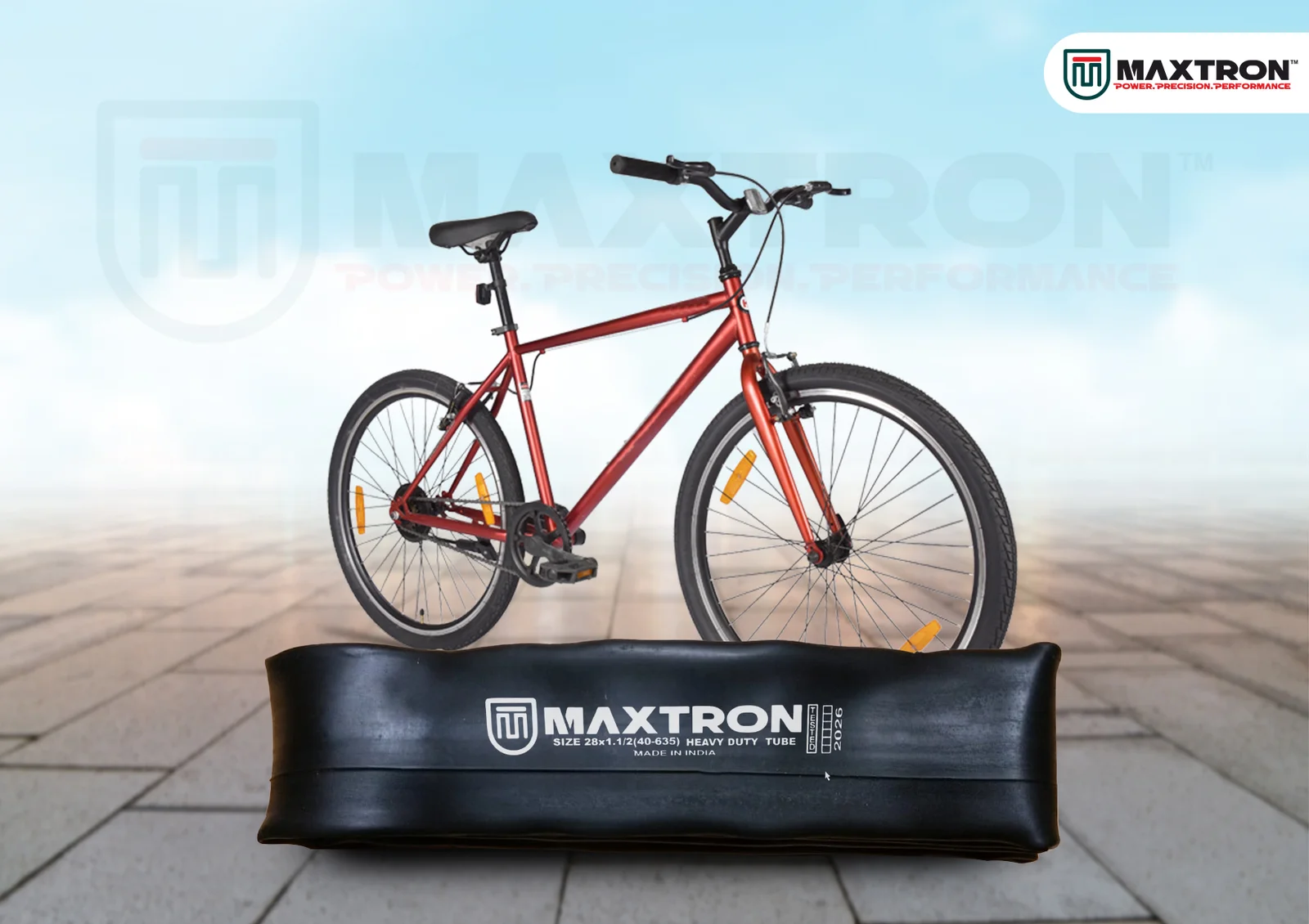 Red city bicycle displayed above a Maxtron moulded bicycle inner tube, showcasing durability, reliability, and premium cycling performance.
