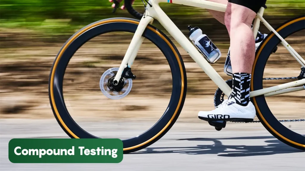 Cyclist riding a bicycle during compound testing, demonstrating real-world performance evaluation of tyre grip, durability, rolling resistance, and ride quality.