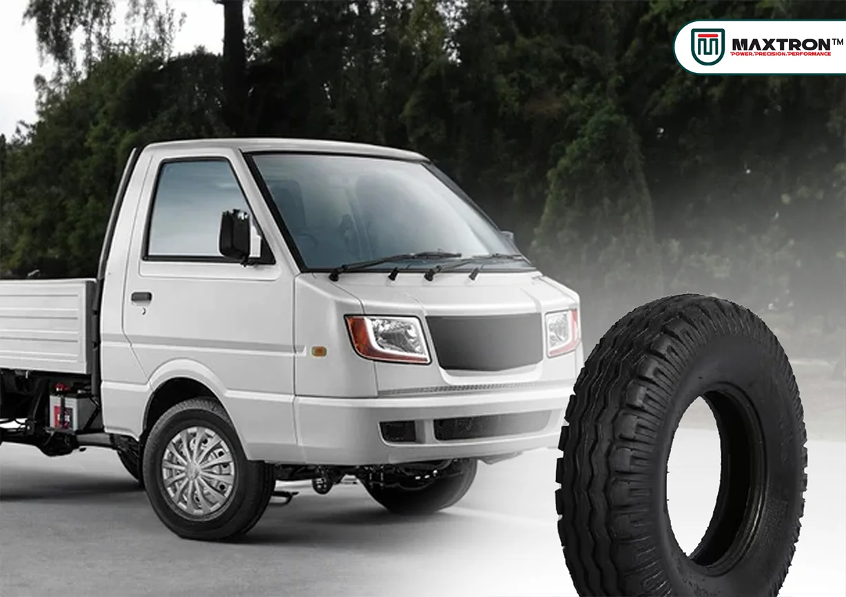 White cargo three-wheeler pickup vehicle with rugged heavy-duty tyre designed for rural transportation, cargo carrying, durability, traction, and reliable commercial performance.