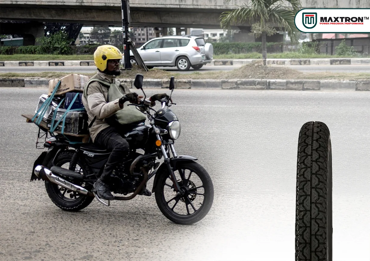 Commuter motorcycle carrying cargo with durable road tyre designed for daily commuting, delivery services, enhanced grip, stability, and long-lasting performance.