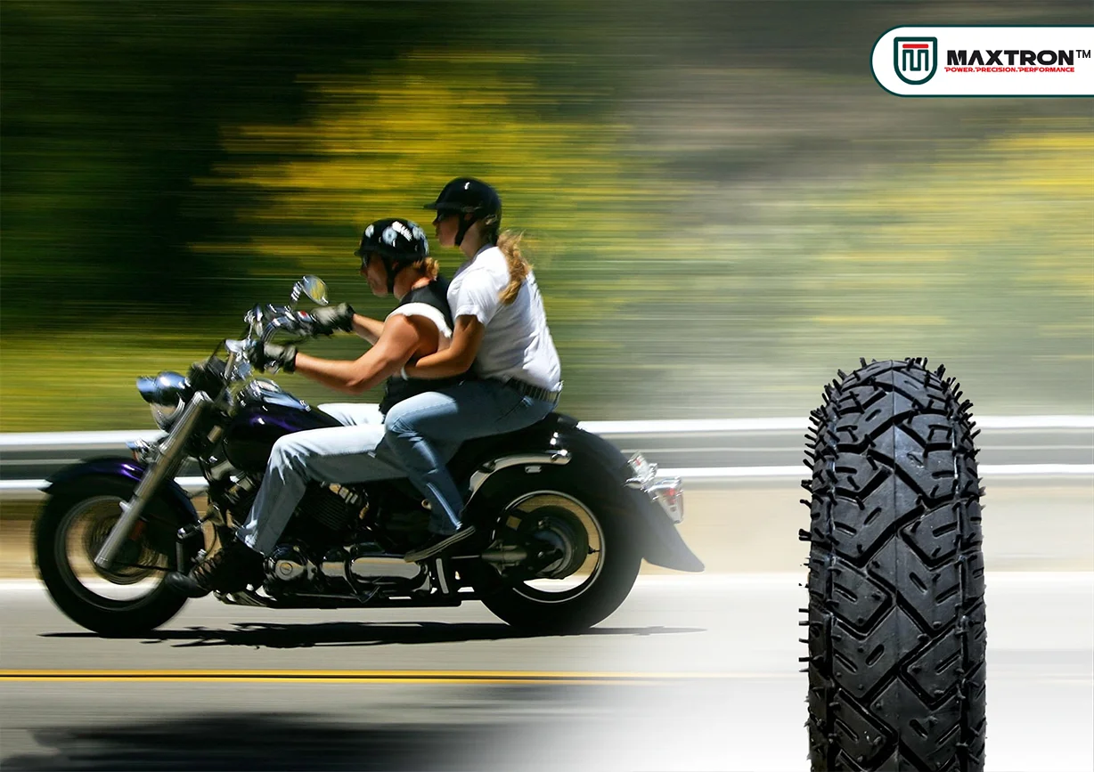 Cruiser motorcycle riding on highway with high-performance touring tyre featuring advanced tread design for stability, comfort, durability, and superior road grip.
