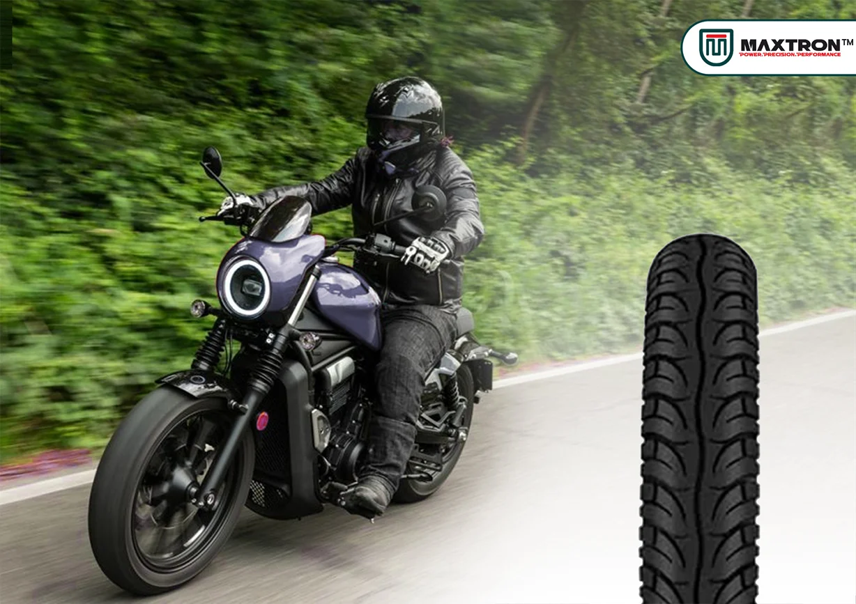 Cruiser motorcycle riding on an open road with premium motorcycle tyre featuring advanced tread pattern for enhanced grip, stability, comfort, and long-distance performance.