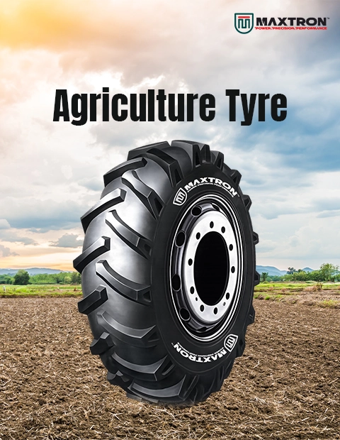 Maxtron agriculture tyre displayed on cultivated farmland, featuring deep lug tread design for superior traction, stability and reliable performance in demanding agricultural applications.