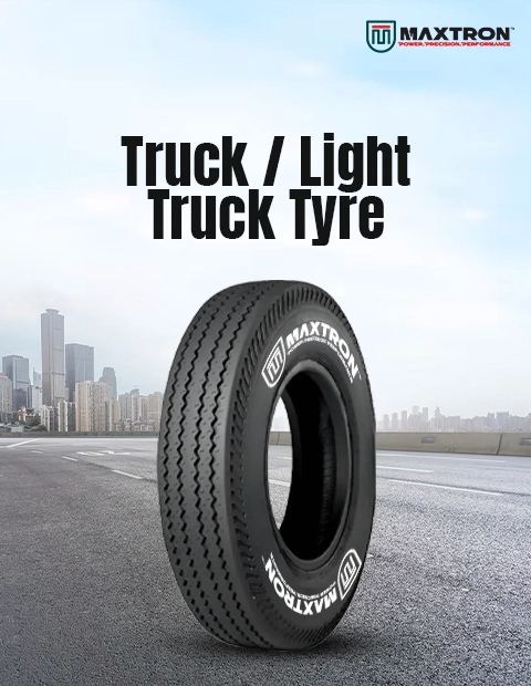 Maxtron Truck and Light Truck tyre displayed on an urban roadway, engineered for commercial transportation, fleet operations and long-distance hauling with enhanced durability and load capacity.
