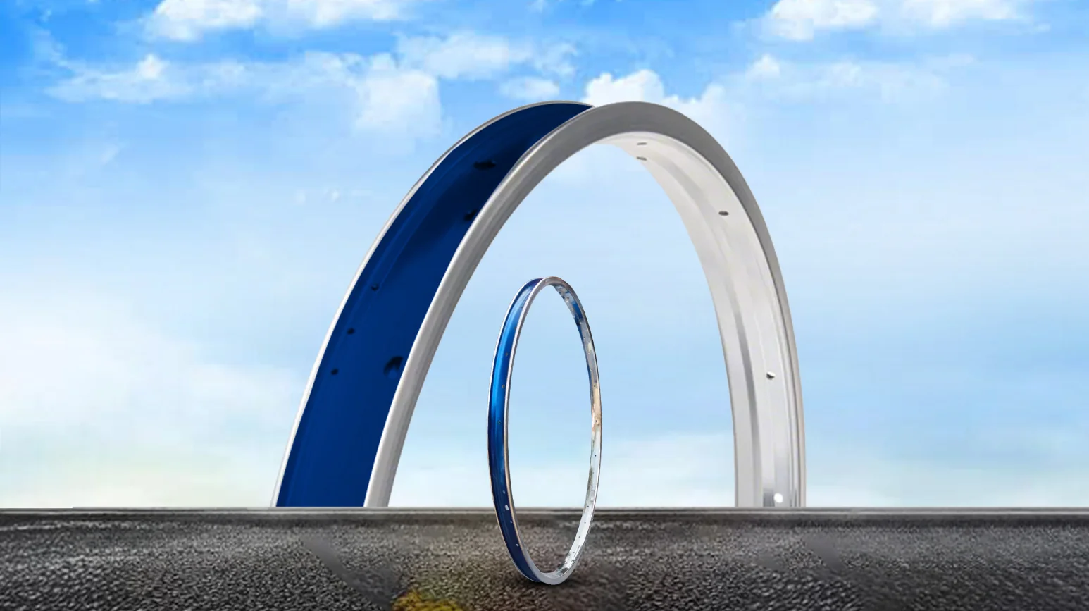 Premium steel and alloy bicycle rims displayed on a road background, showcasing lightweight construction, durability, precision engineering, and reliable cycling performance.