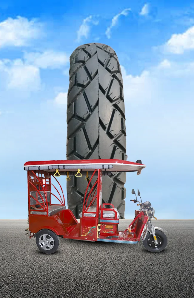 Red electric rickshaw with heavy-duty tyre designed for passenger transportation, superior grip, durability, stability, and long-lasting urban mobility performance.