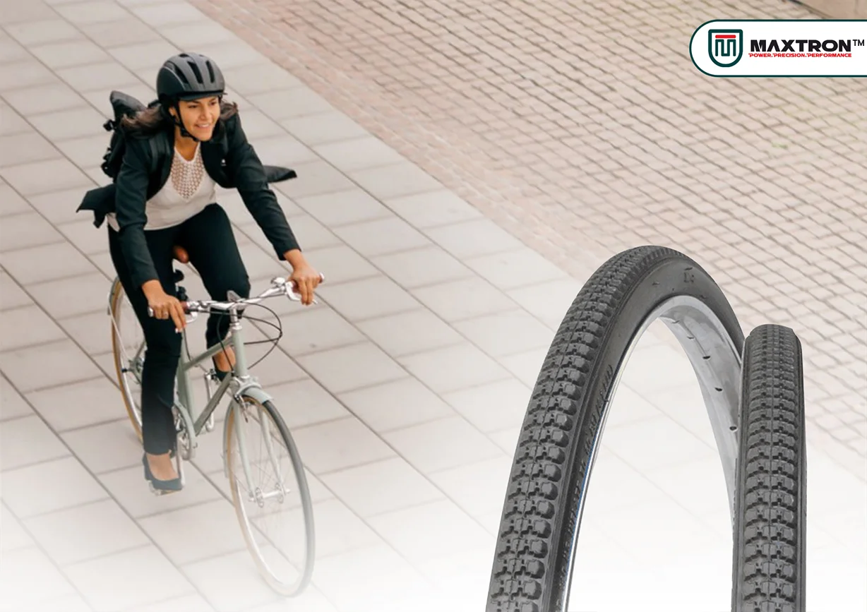 Urban cyclist riding a bicycle in the city with premium city bicycle tyres featuring durable tread patterns, smooth rolling performance, excellent grip, and reliable commuting comfort.