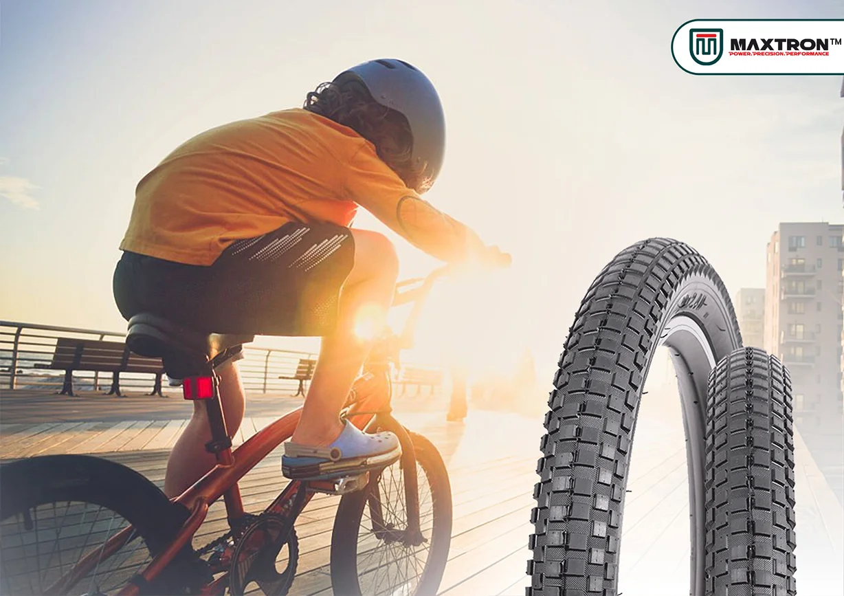 Young cyclist riding a bicycle in an urban environment with premium kids bicycle tyres featuring durable tread patterns, enhanced grip, stability, and smooth riding performance.