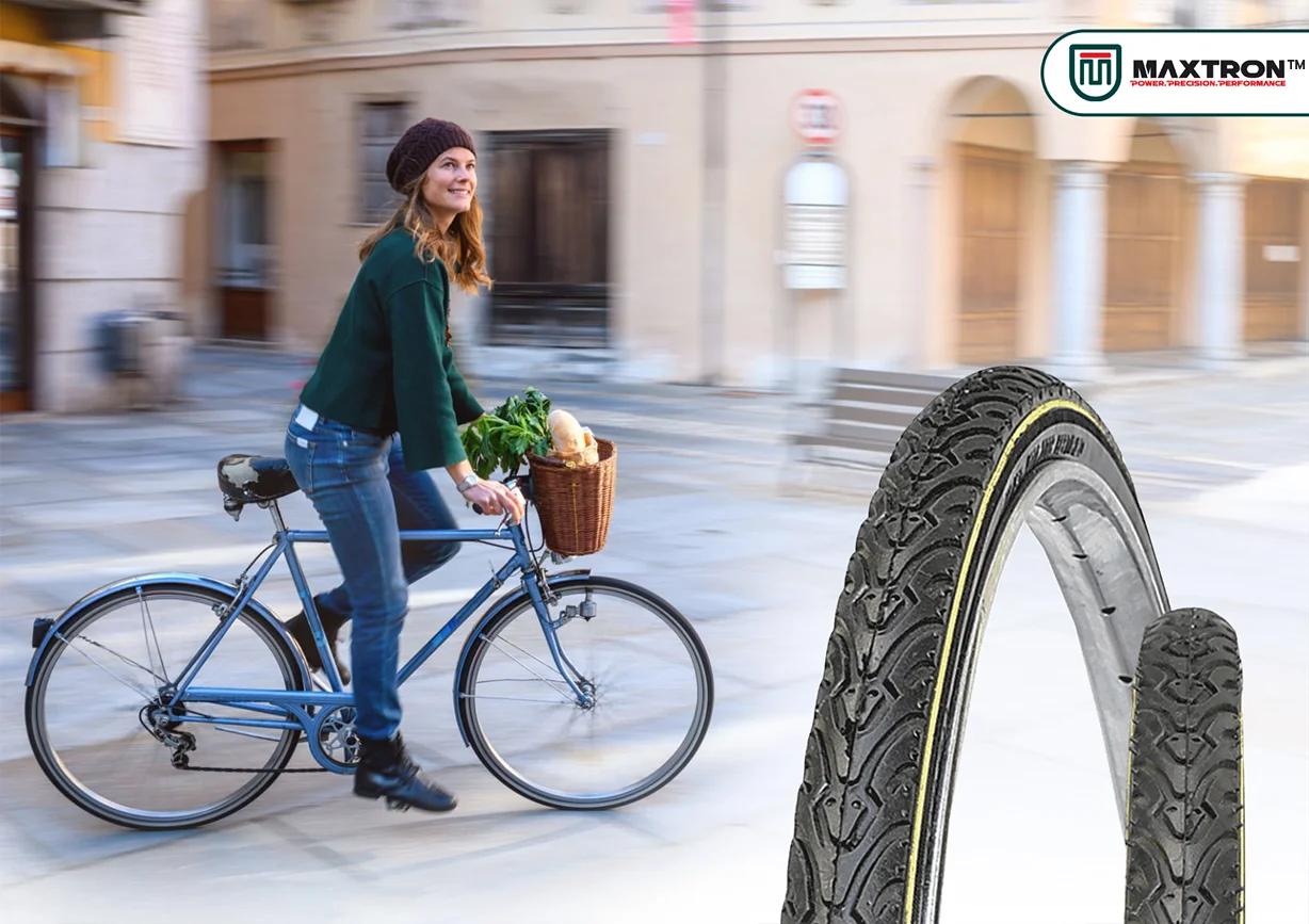 Urban cyclist riding a utility bicycle with a basket, alongside premium city bicycle tyres designed for superior grip, durability, comfort, and reliable daily commuting performance.