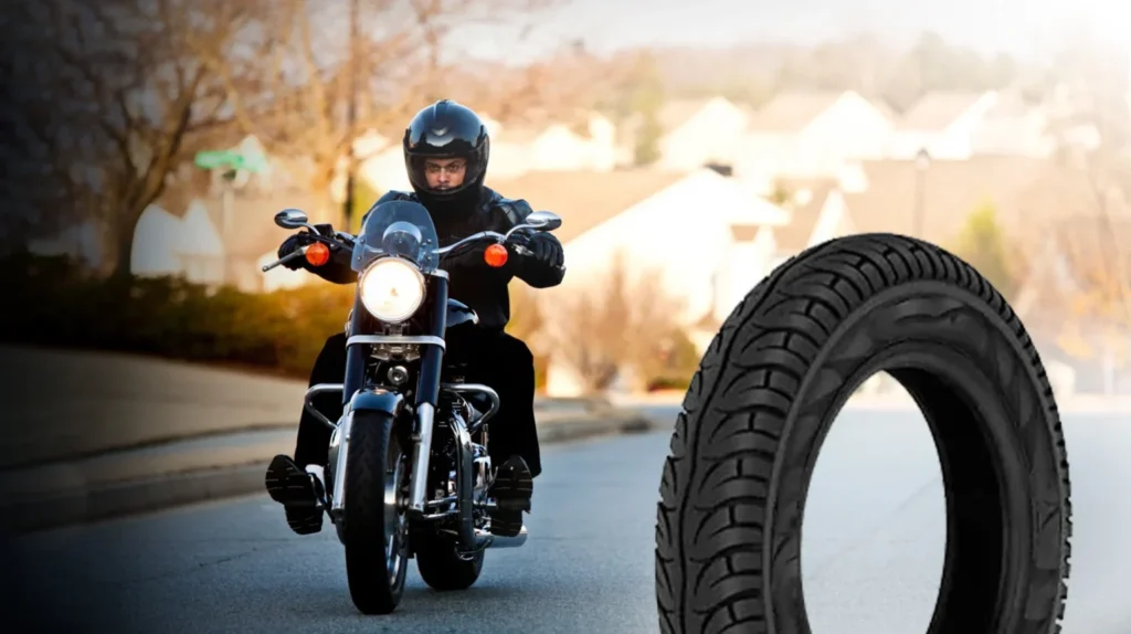 Motorcyclist riding on a road with a premium motorcycle tyre displayed in the foreground, showcasing advanced tread design, superior grip, durability, and reliable road performance.