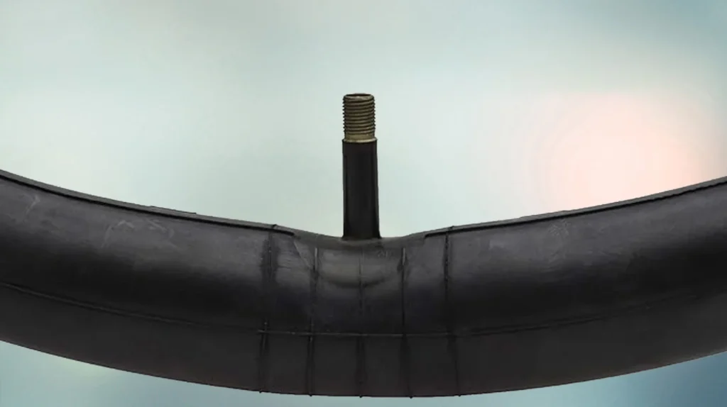Close-up view of a premium bicycle inner tube valve showcasing durable construction, secure air retention, and reliable inflation performance for bicycle tubes.
