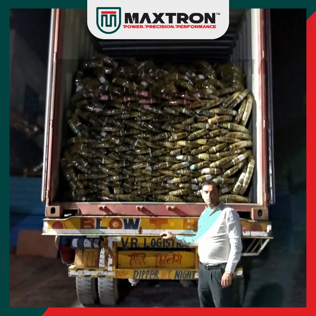 Maxtron bicycle tyres stacked inside an export shipping container with a team member supervising the completed bulk loading for international shipment.