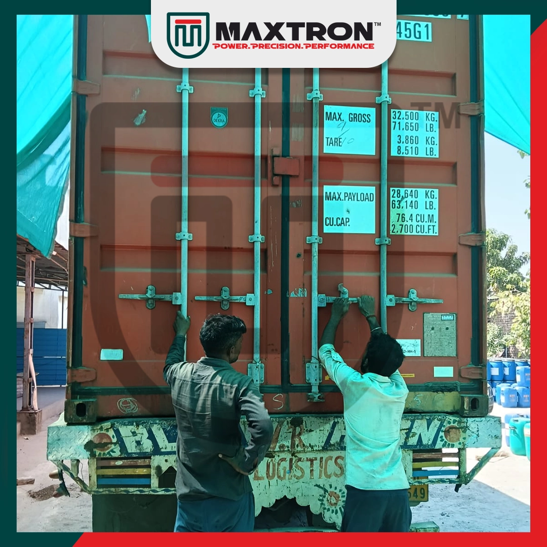 Workers sealing a Maxtron export shipping container after loading premium bicycle tyres for secure international transportation and global B2B delivery.