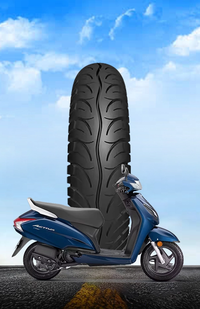 Blue scooter with Maxtron premium scooter tyre featuring an advanced tread pattern for superior grip, stability, and urban road performance.