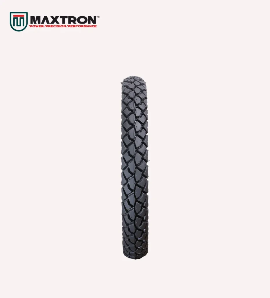 Maxtron M-105 motorcycle tyre with block tread pattern for superior traction, stability, durability, and dependable on-road and mixed-terrain performance.