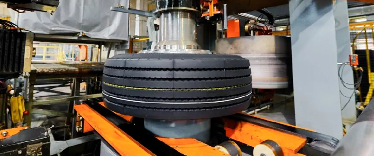 Advanced tyre manufacturing process at Maxtron production facility, showcasing precision engineering, automated machinery and stringent quality control for commercial and industrial tyres.